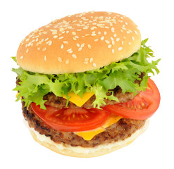 Double cheeseburger with lettuce and tomato in a sesame seed bread roll