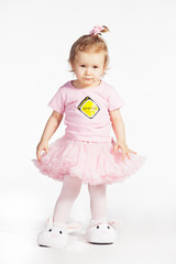 Little girl in a pink clothes