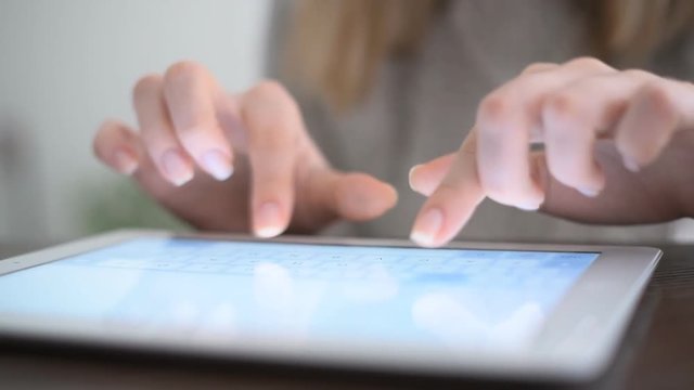 Hand touching screen on modern digital tablet pc.