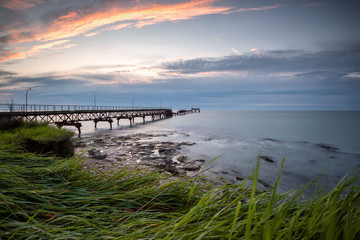 Fototapeta premium Rocky beach at sunrise. Magnificent sea sunrise near Shabla, Bulgaria.