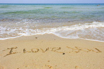Fototapeta na wymiar I love you text on sand , seashore of Chang island, Thailand