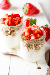 Strawberries desert with cream and cereals