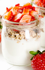 Strawberries desert with cream and cereals