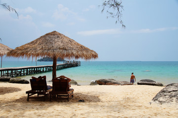 Two chairs and umbrella on tropical island, Cambodia