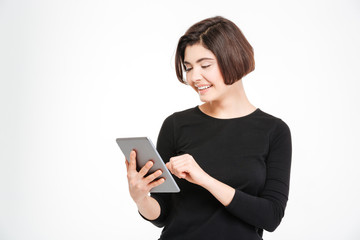 Fototapeta premium Smiling woman using tablet computer