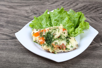 Meat covered cheese and tomato