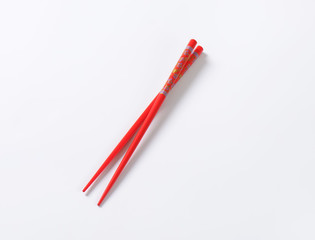 Red chopsticks with flower pattern