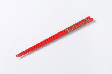 Red chopsticks with flower pattern