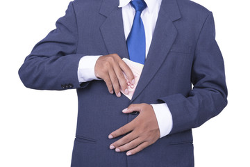 Obraz premium Businessman putting money in pocket