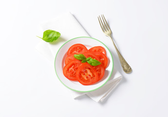 sliced tomato with basil