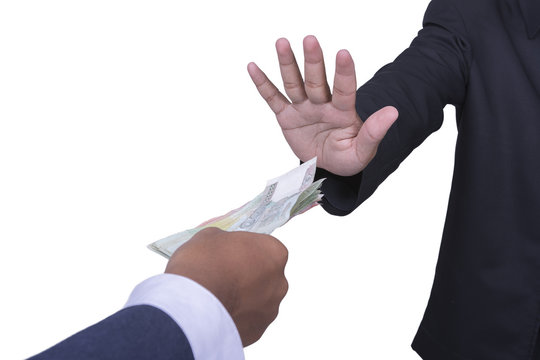 businessman holding money rejecting a bribe