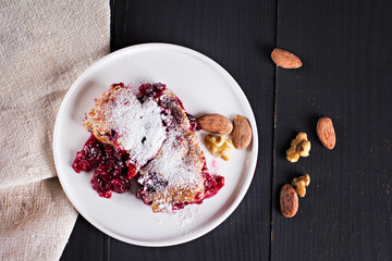 Cherry pie and a cup of coffee. Rustic style. Berry pie. Homemade cherry pie with flaky crust, cup of coffee, bowl with cherries