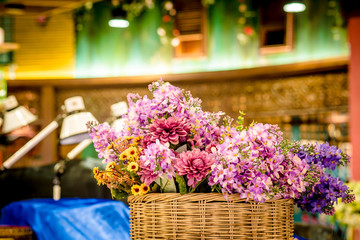 bouquet of bright flowers in basket
