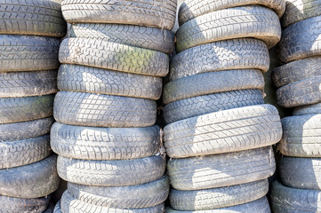 Pile of used old car tires.