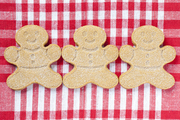 close-up shot of three gingerbread men.