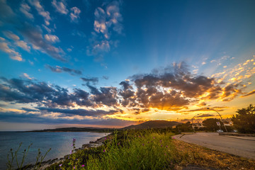 Fototapeta premium Colorful sky over Alghero coastline at sunset