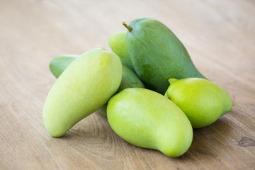 Green Mango on a wooden table