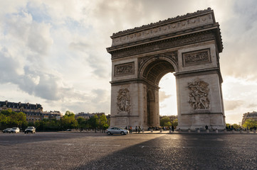 Fototapeta na wymiar Triumphal arch view in Paris city at sunset. Arc de Triomphe, paris, France.