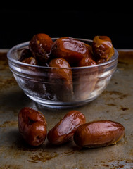dried dates on steel plate