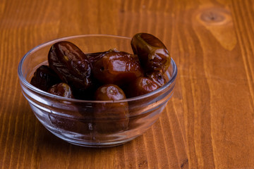 dried dates on wooden table