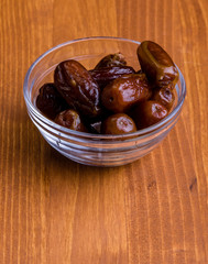 dried dates on wooden table