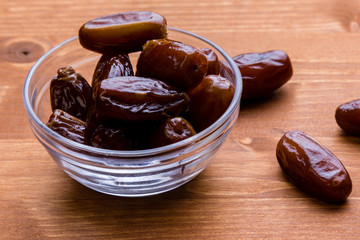 dried dates on wooden table