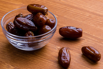 dried dates on wooden table