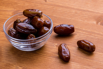 dried dates on wooden table