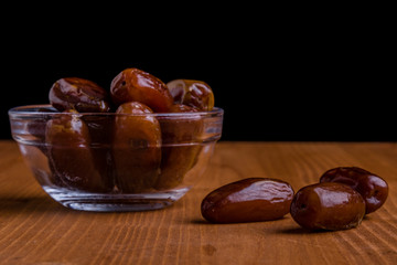 dried dates on wooden table