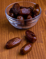 dried dates on wooden table