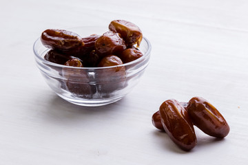 dried dates on white table