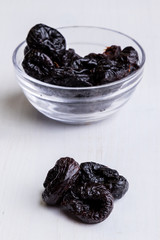 prunes on white table