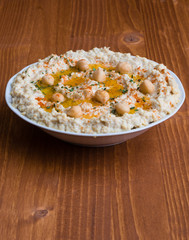 home made hummus on wooden table