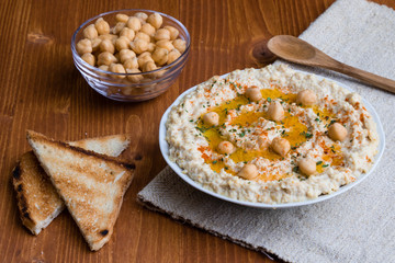home made hummus on wooden table