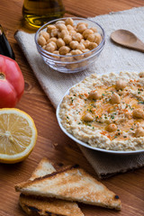 home made hummus on wooden table