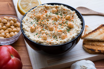 hummus in black bowl