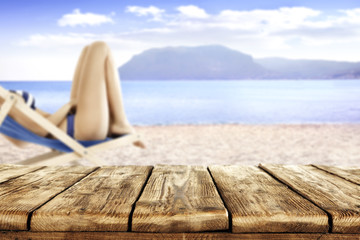 table and woman on sand 