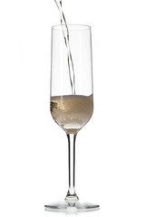 champagne being poured in flute.