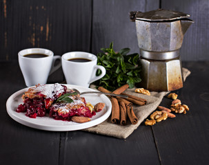 Cherry pie and a cup of coffee. Rustic style. Berry pie. Homemade cherry pie with flaky crust, cup of coffee, bowl with cherries