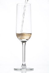 champagne being poured into an empty glass.