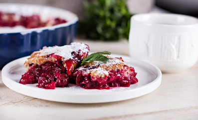 Cherry pie and a cup of tea. Rustic style. Berry pie. Homemade cherry pie with flaky crust, cup of coffee, bowl with cherries