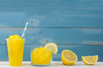 Lemon slushie on blue wood

