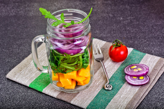 Salad with Pumpkin, Arugula and Red Onion in Glass Jar