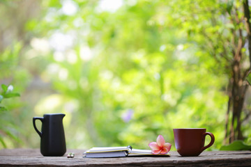 vintage  teapot  with cup and notebooks  