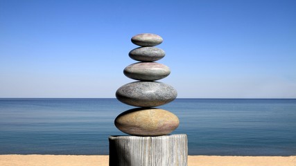 3D rendering of balancing Zen stones on the beach, with blue sky and peaceful seascape.