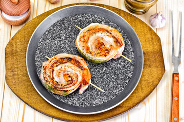 Roll of Bacon with Mushrooms, Carrots, Greens, Barbecue Grill