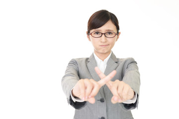 禁止の意思表示をするビジネスウーマン