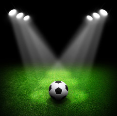 Soccer ball on green stadium