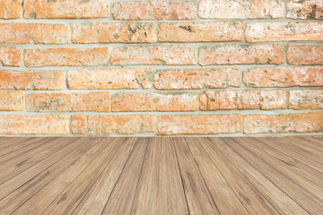 brown wood panel against brick wall.