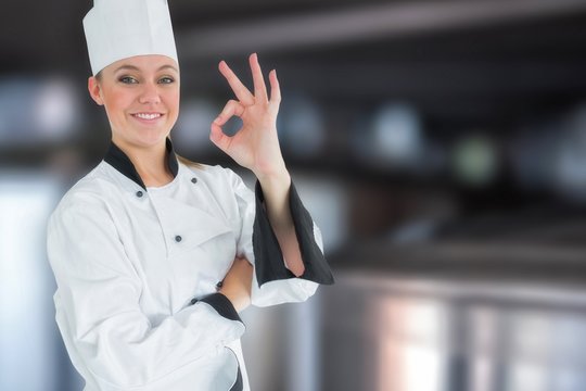 Composite image of happy female chef gesturing ok sign